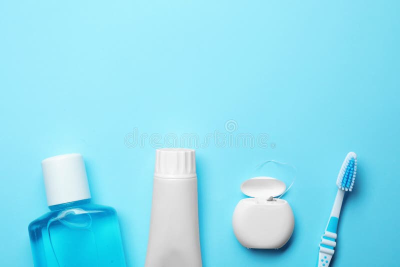 Flat lay composition with toothpaste, oral hygiene products and space for text on color background. Flat lay composition with toothpaste, oral hygiene products and space for text on color background