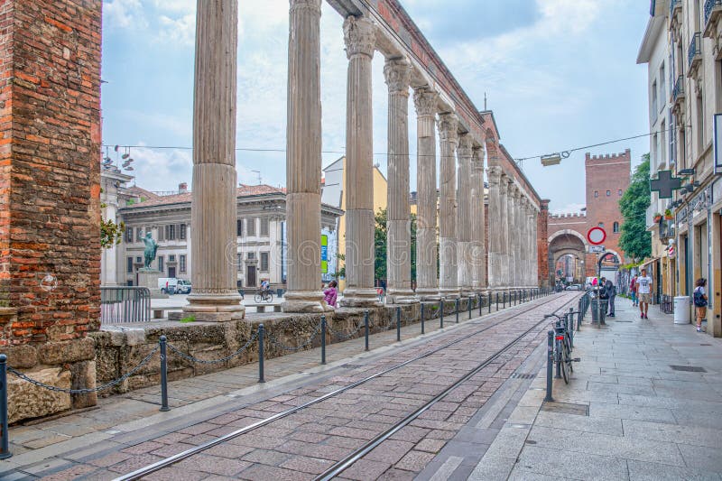 MILANO, ITALY, JULY 19, 2019: Arcade of San Lorenzo leading to the Porta Ticinese in Milano, Italy. MILANO, ITALY, JULY 19, 2019: Arcade of San Lorenzo leading to the Porta Ticinese in Milano, Italy