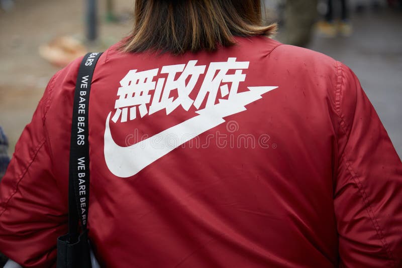 Woman with Red Bomber Jacket with White Nike Japanese before Fendi Fashion Show, Milan Fashion Week Editorial Photo - of look, street: 194554491