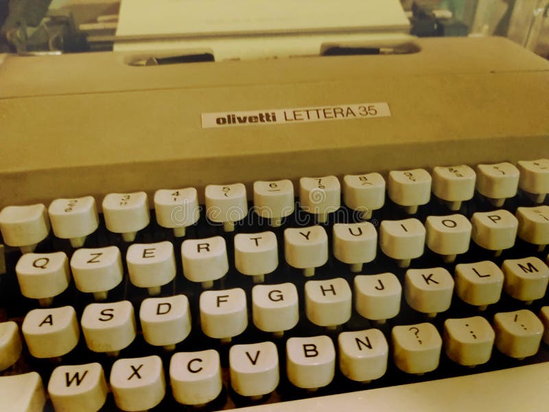 Milan, Italy - February 3, 2019: Vintage classic car show - Old retro Olivetti Lettera 35 typewriter, writing machine - old photo royalty free stock image Milan, Italy - February 3, 2019: Vintage classic car show - Old retro Olivetti Lettera 35 typewriter, writing machine - old photo royalty free stock image