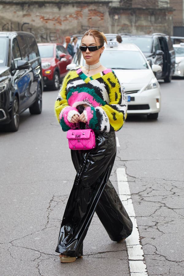 Woman with Colorful Sequin Jacket and Blue Crocodile Leather Bag