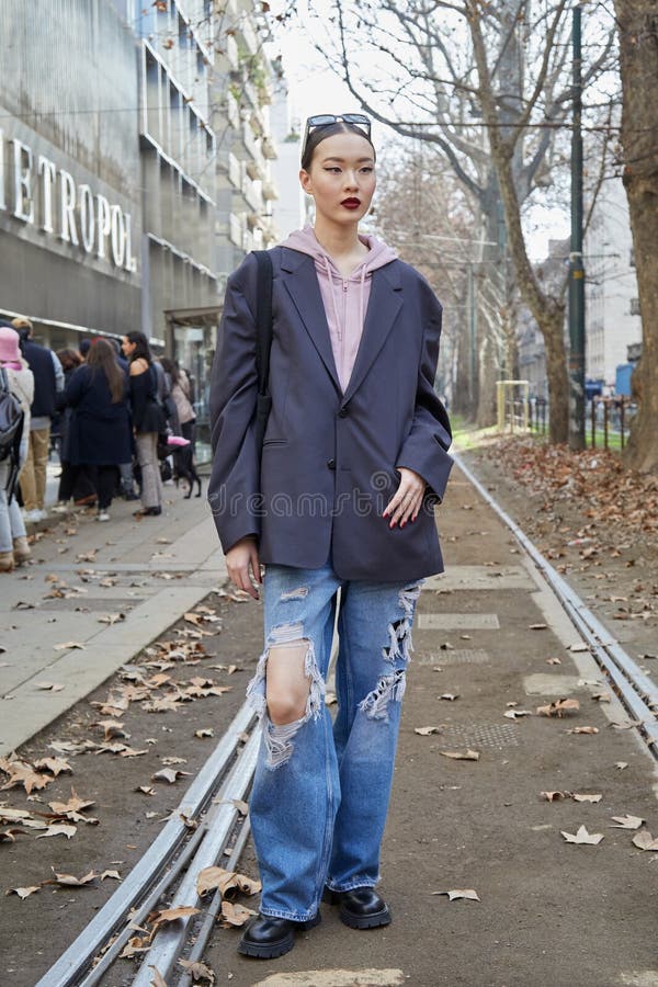 MILAN, ITALY - FEBRUARY 24, 2023: Woman with blue denim Louis