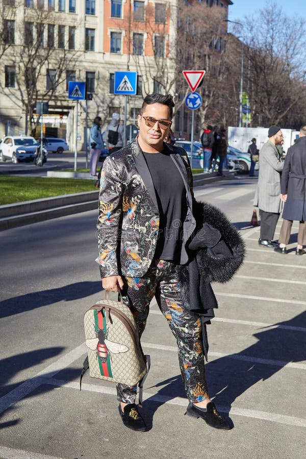 MILAN, ITALY - FEBRUARY 23, 2022: Man with Gucci bag, backpack and