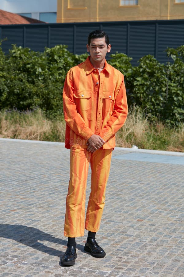 Man with red denim Louis Vuitton Supreme jacket before Fendi fashion show,  Milan Fashion Week street style – Stock Editorial Photo © AndreaA.  #326232854