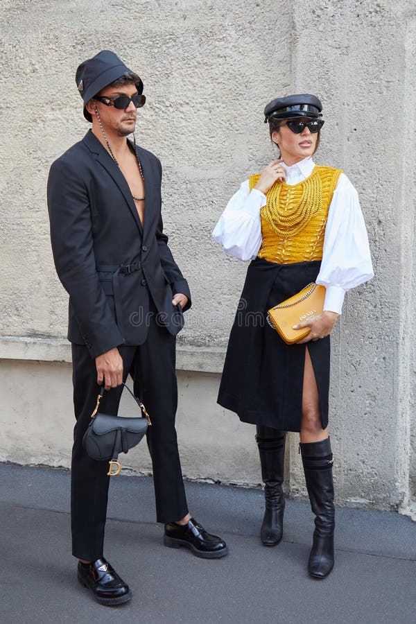Woman with yellow Chanel bag before Prada fashion show, Milan
