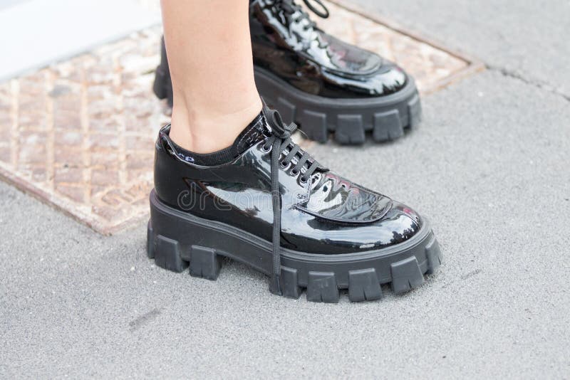 Model Wearing a Pair of Shiny Black Shoes with a Very High Rubber Sole  Editorial Photo - Image of editorial, fashion: 159360201