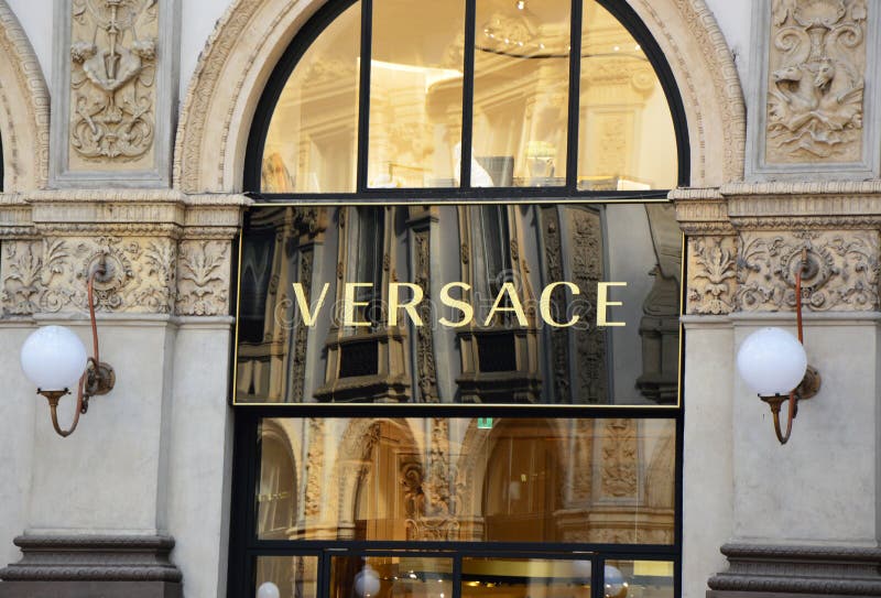 MILAN, ITALY - SEPTEMBER 7, 2017: Versace signboard in Galleria Vittorio Emanuelle II, Milan, Italy stock photos MILAN, ITALY - SEPTEMBER 7, 2017: Versace signboard in Galleria Vittorio Emanuelle II, Milan, Italy stock photos