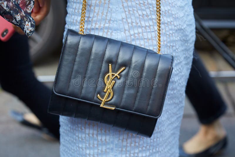 Woman with Louis Vuitton black crocodile leather bag before Gucci fashion  show, Milan Fashion Week street style on September 21 Stock Photo - Alamy