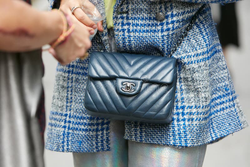 Woman with black Chanel patent leather bag before Genny fashion show, Milan  Fashion Week street style on September 22, in Milan Stock Photo - Alamy