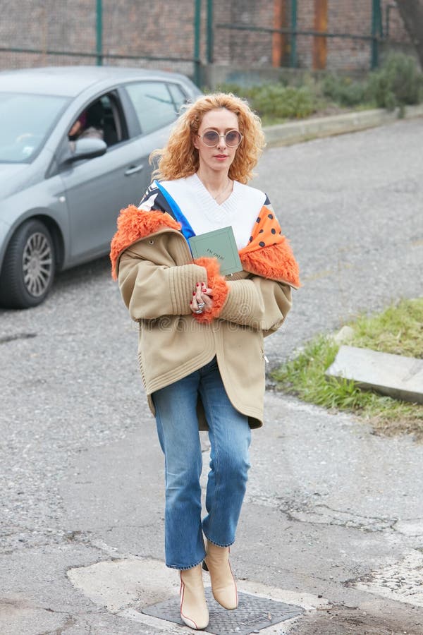 MILAN - SEPTEMBER 21: Elina Halimi with jeans jacket and red Supreme bag  before Fendi fashion show, Milan Fashion Week street style on September 21,  2 Stock Photo - Alamy