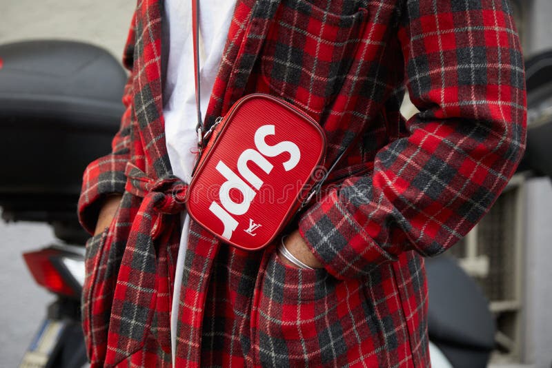 Man with Red Tartan Coat and Louis Vuitton Supreme Bag before