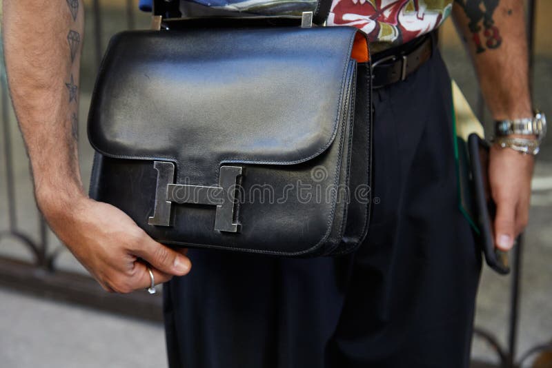 MILAN, ITALY - JUNE 15, 2019: Man with Vacheron Constantin watch and black  leather Hermes bag before Emporio Armani fashion show, Milan Fashion Week s  Stock Photo - Alamy