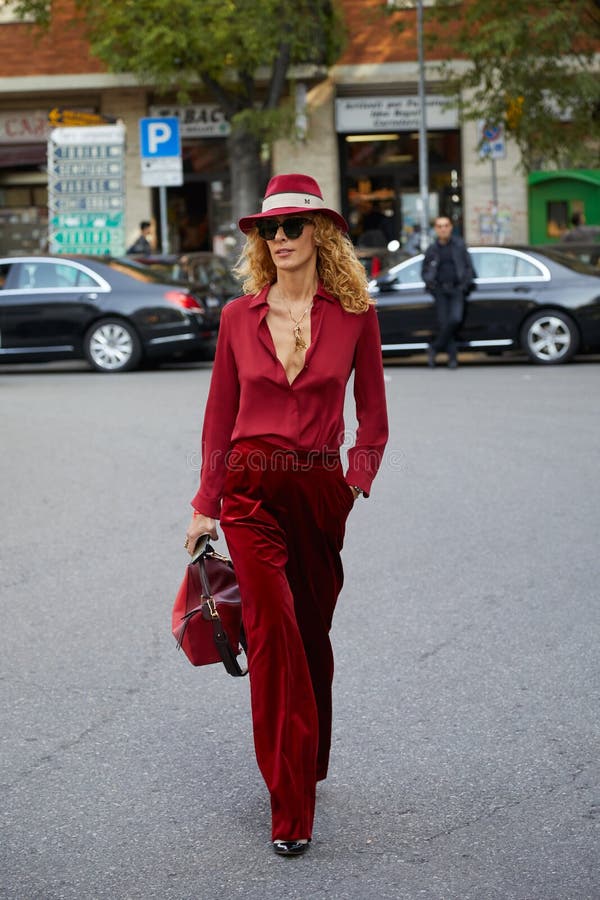 MILAN - SEPTEMBER 21: Elina Halimi with jeans jacket and red Supreme bag  before Fendi fashion show, Milan Fashion Week street style on September 21,  2 Stock Photo - Alamy