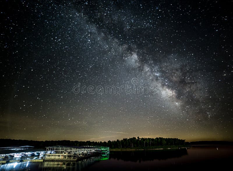 Milky Way reflecting into the lake near a boat dock. Milky Way reflecting into the lake near a boat dock.