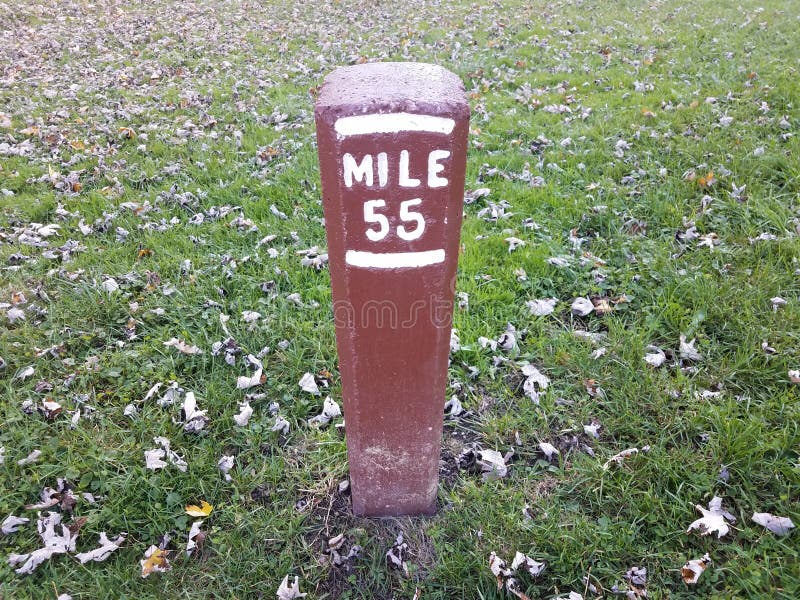 Mile Marker 55 or Post in Ground with Grass Stock Photo Image of