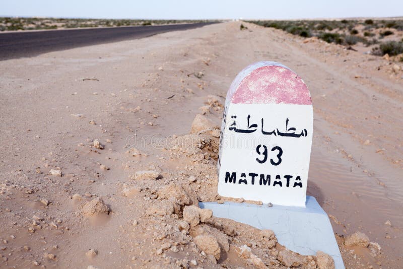Milepost on a desert asphalt road to the Matmata destination, Tunisia, Africa. Road passing through the salt lake Chott El Djerid