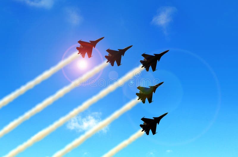Militarni aerobatic strumienie pod niebieskim niebem podczas pokazu lotniczego