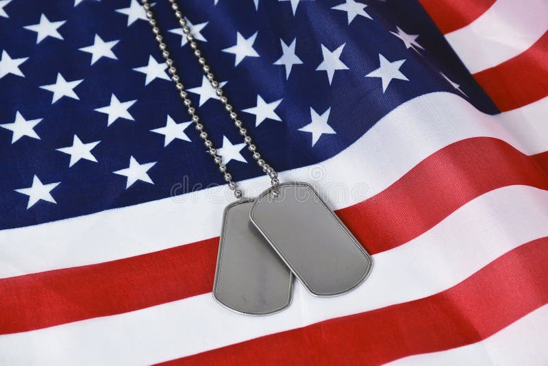 Military Dog Tags on American Flag Stock Image Image of vivid