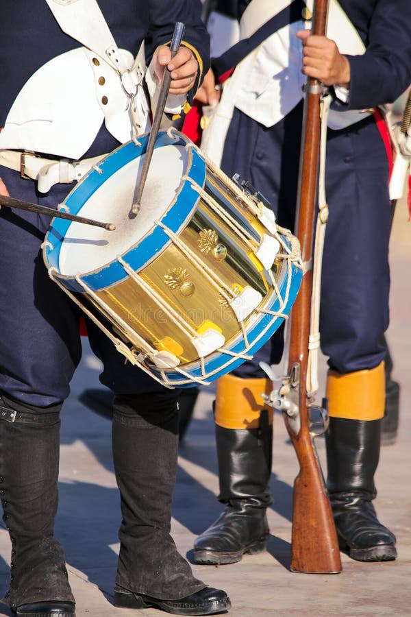 Military drummer and soldier armed with musket