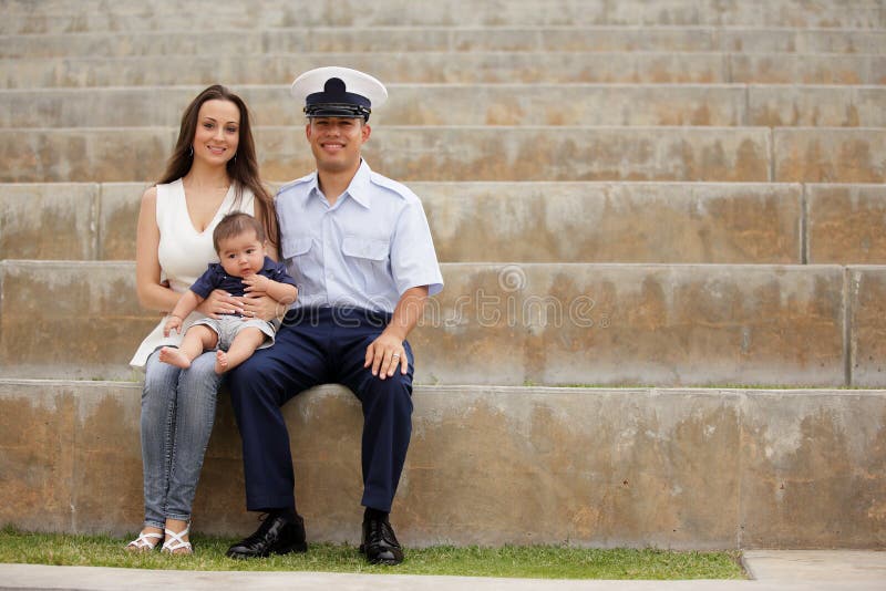 Military family sitting in the park