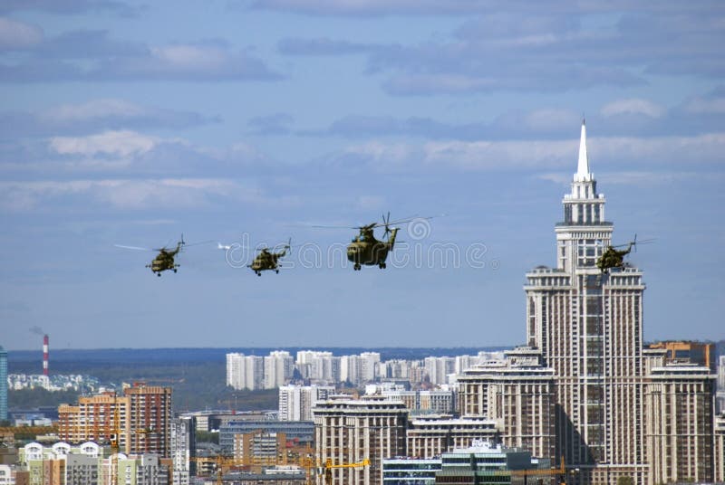 Military helicopters in the sky. Moscow city panorama royalty free stock photos Military helicopters in the sky. Moscow city panorama royalty free stock photos