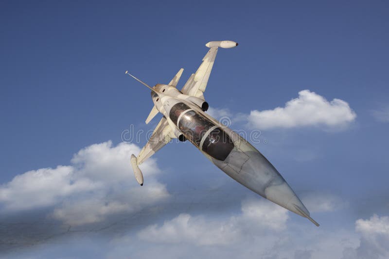 Military jet plane flying over white cloud royalty free stock photography
