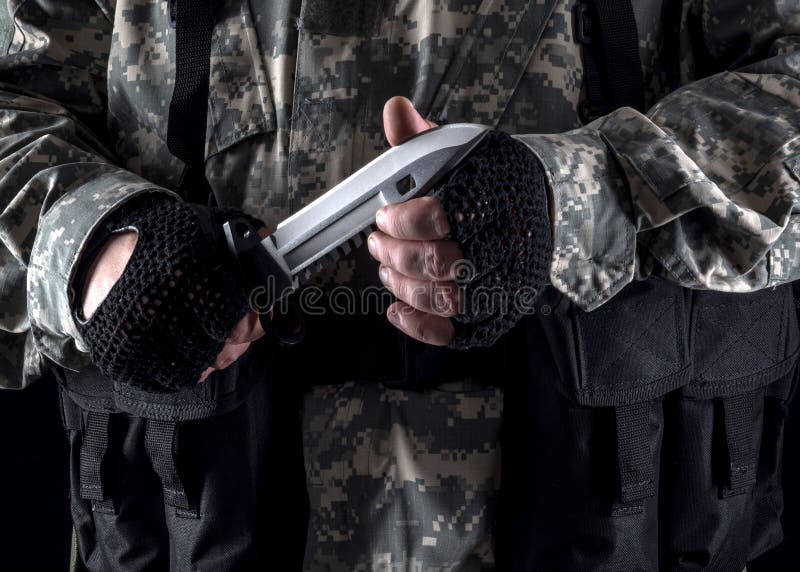 Military man with a knife in a hand close up stock images Military man with a knife in a hand close up stock images