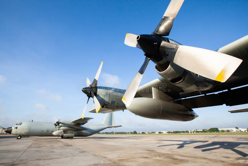 Military transport aircraft on runway at an airport in Asia, are primarily used to transport troops and war supplies