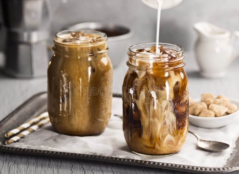 https://thumbs.dreamstime.com/b/milk-being-poured-glass-iced-coffee-stream-jar-filled-52506090.jpg