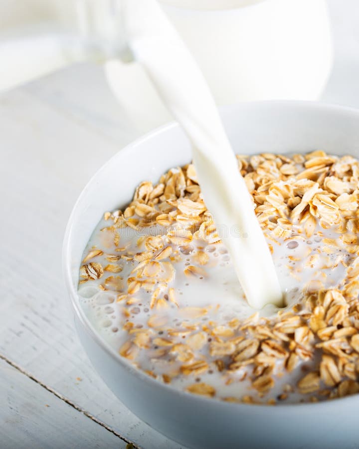 Milk Poured in a Cereal Bowl Stock Photo - Image of cornflakes, berry ...