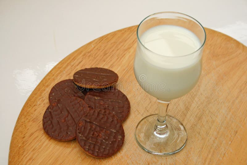 Milk and biscuits stock photo. Image of beverage, board 11583804
