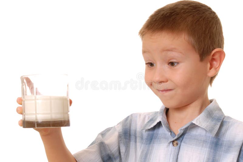 Milk Boy 2. Young boy holding a glass of milk.