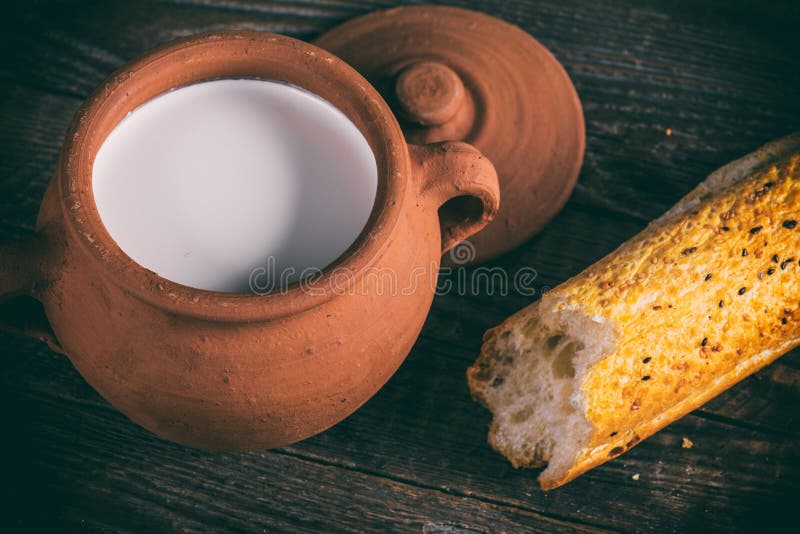 Milk in clay pot stock image. Image of handmade, fresh 65469669