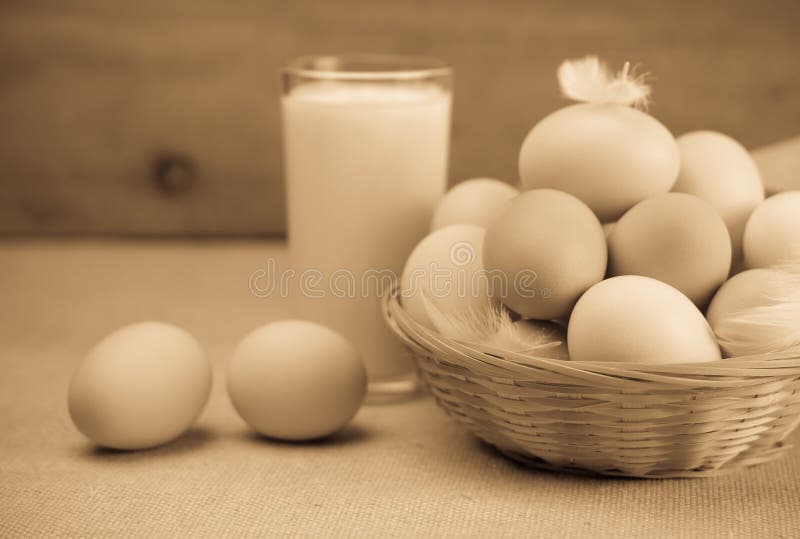 Milk and a basket of eggs. Sepia. Milk and a basket of eggs. Sepia
