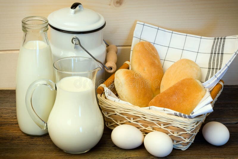 Traditional countryside breakfast - milk, eggs and buns. Traditional countryside breakfast - milk, eggs and buns