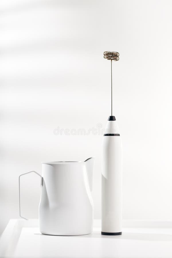 https://thumbs.dreamstime.com/b/milk-frother-white-pitcher-coffee-minimalist-table-268113657.jpg