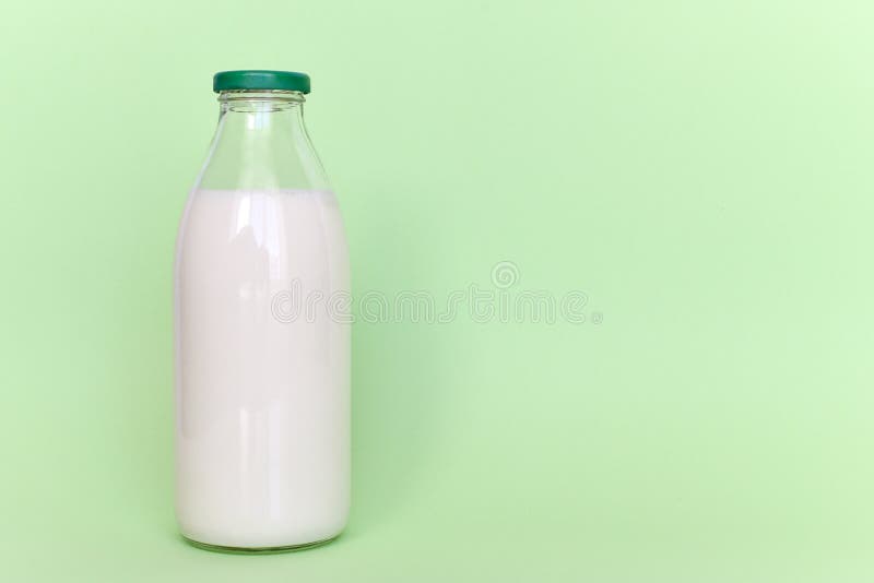 Milk in a glass bottle stock image. Image of green, food 117290267