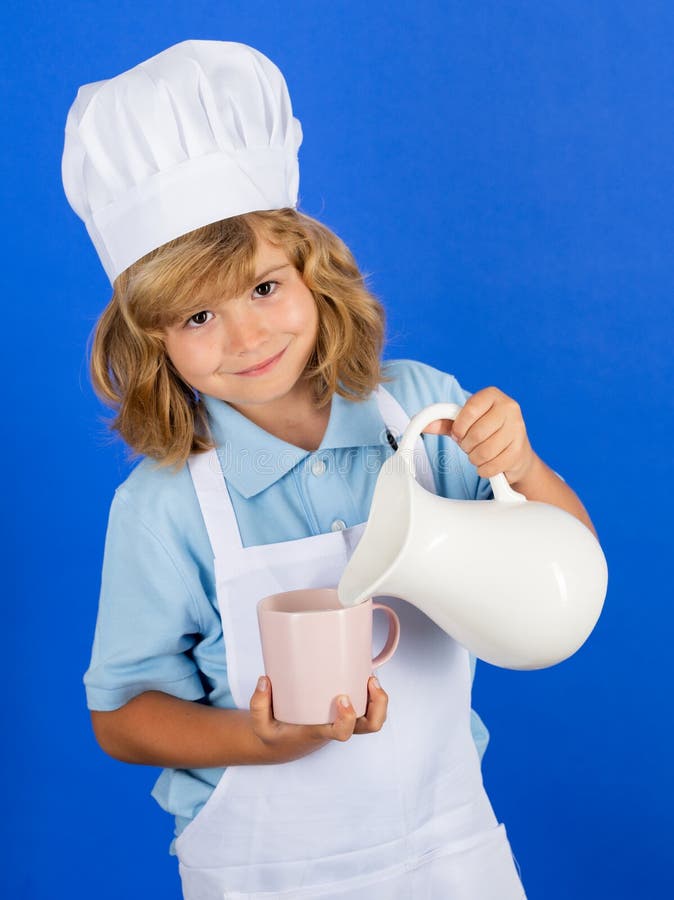 Milk for Kids. Child Chef Cook Prepares Food in Isolated Blue Studio