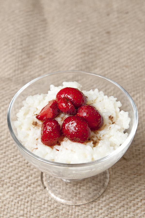 Milk and rice pudding with strawberries