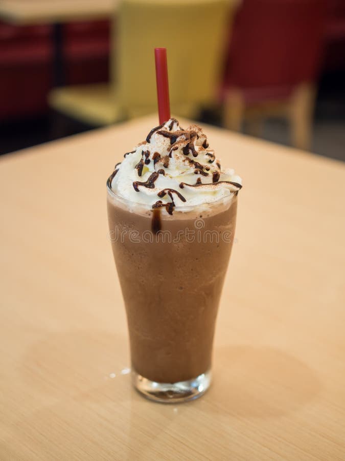 Delicious chocolate frappe with whipped cream on table. Delicious chocolate frappe with whipped cream on table