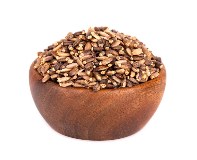 Milk Thistle seed in wooden bowl, isolated on white background. Silybum marianum, Scotch Thistle or Marian Thistle. royalty free stock photo