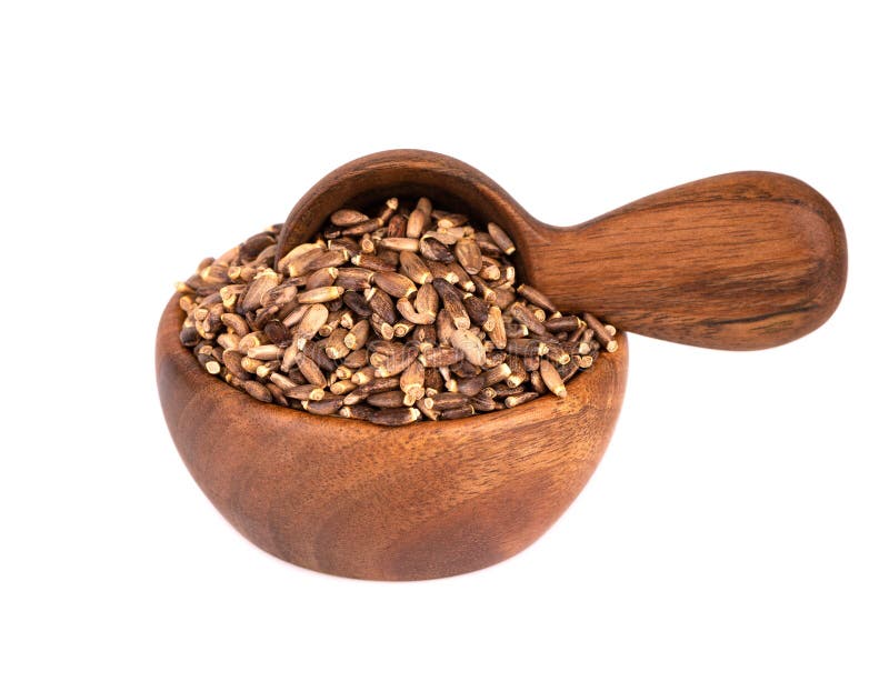 Milk Thistle seed in wooden bowl and spoon, isolated on white background. Silybum marianum, Scotch Thistle or Marian royalty free stock image