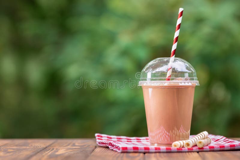 https://thumbs.dreamstime.com/b/milkshake-disposable-plastic-cup-chocolate-milkshake-disposable-plastic-cup-wafer-rolls-wooden-table-outdoors-157366954.jpg