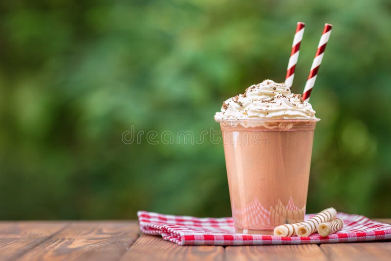 https://thumbs.dreamstime.com/b/milkshake-disposable-plastic-cup-chocolate-whipped-cream-wafer-rolls-wooden-table-outdoors-156817597.jpg