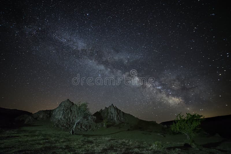 The Milky Way Galaxy rising above rocky landscape