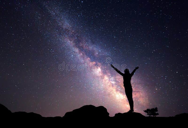 Milky Way. Night sky with stars and silhouette of a woman