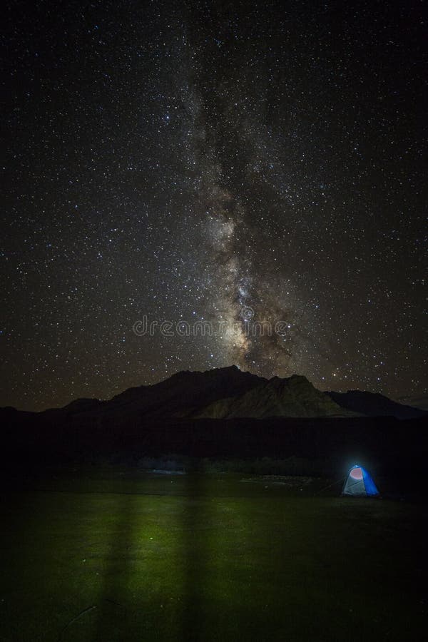 Milky way star shining above illuminated tents Himalaya mountain pass stock image Milky way star shining above illuminated tents Himalaya mountain pass stock image