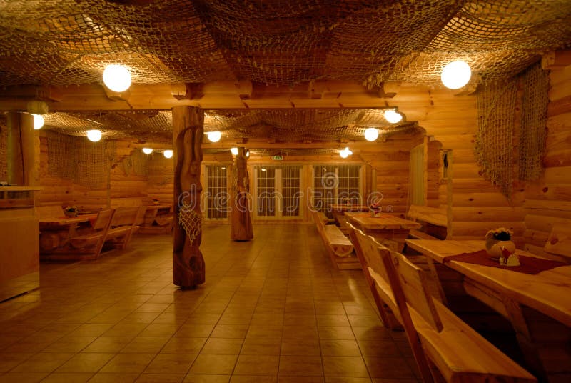 Milled log house interior - view inside wooden country guesthouse.