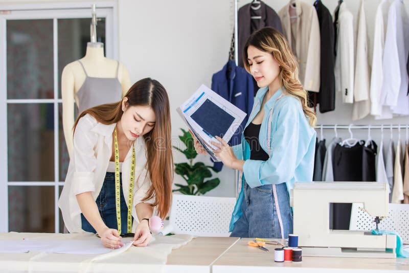 Millennial Asian Young Beautiful Professional Female Dressmaker Designer  Seamstress with Measuring Tape Sitting Smiling Stock Photo - Image of  holding, clothes: 282933186