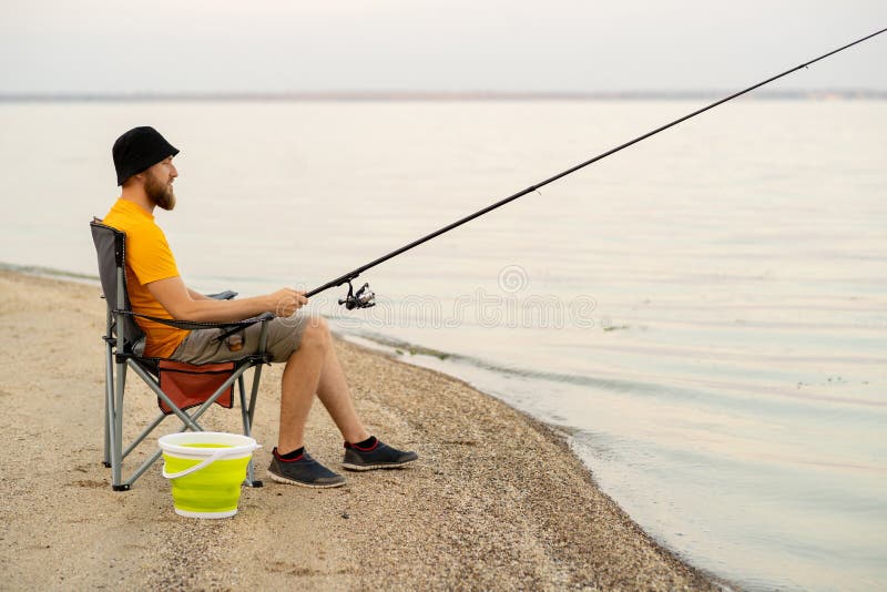 521 Man Fishing Sitting Chair Stock Photos - Free & Royalty-Free